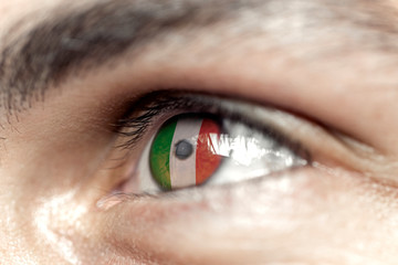 Flag of Italia reflects in a man brown eye - election, sport, hope, young, generation	