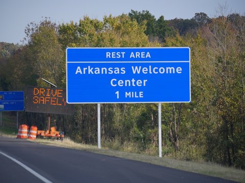 Roadside sign to the Arkansas Welcome Center in Van Buren, Arkansas.