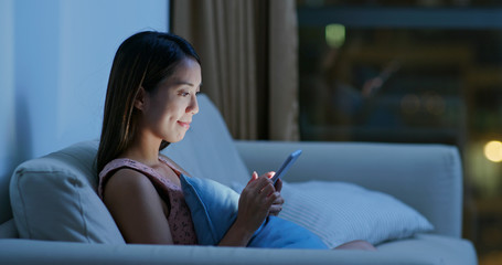 Woman use of smart phone at home
