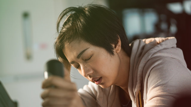 South East Asian Woman Exhausted From Overtraining Unhealthy Excercise