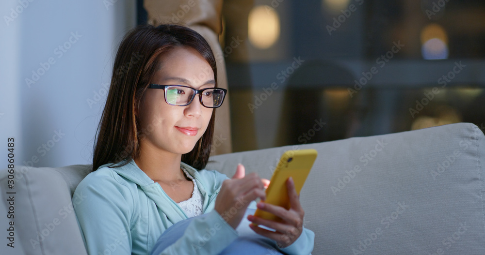 Sticker Woman with glasses and use of mobile phone at home