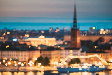 Gordijnen Stockholm, Zweden. Nacht Skyline Abstracte Boke Bokeh Achtergrond. Ontwerp achtergrond. Riddarholm Kerk In Nachtverlichting. © Grigory Bruev