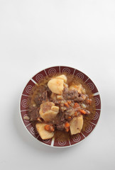 dish of stewed beef with potatoes and carrot