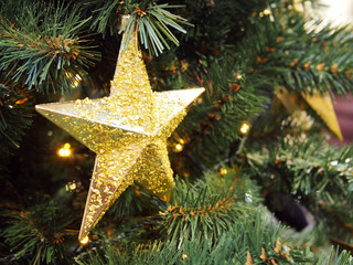 Christmas and new year decorations on the Christmas tree, close-up, holiday concept. There is free space for text on the photo.