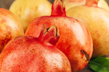 Group of pomegranate fruits close up background