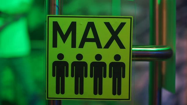 Sign designation four persons.