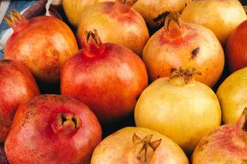 Fototapeta na wymiar Group of pomegranate fruits close up background