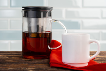 Tea served on a wooden kitchen table