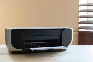 Close up of an office table with printer on it