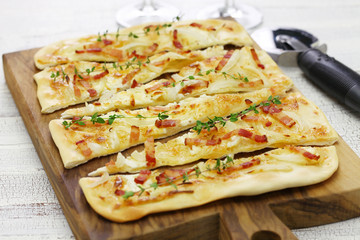 traditional alsatian pie, tart flambe, flammekueche, bacon onion cream cheese pizza