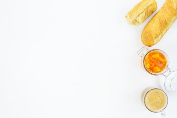 Pumpkin jam with orange on a white table. Horizontal orientation, copy space.
