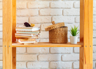 Wooden shelf with home decor on ot