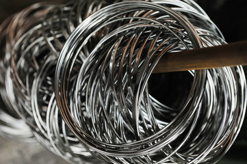 Close-up of stainless steel wire coils in warehouse