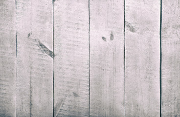 The empty wooden white table. The background from painted planks from wood