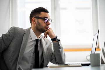 Young businessman is working in office.