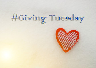 Giving Tuesday concept. Heart in the snow