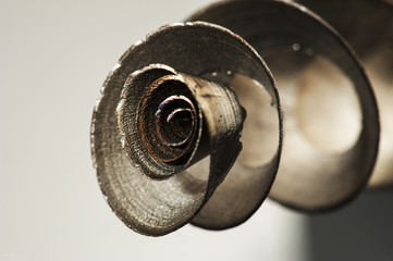 Scrap Metal Shavings. Beautiful decorative metal shavings on a gray background