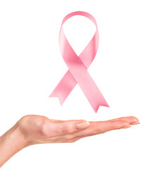 Female hand shows pink breast cancer awareness ribbon. - 306866477