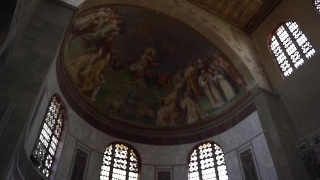 Pan past beautiful ceiling paintwork in an Italian chapel