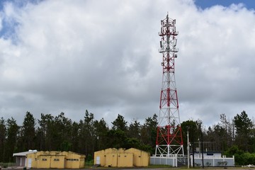 Fototapeta na wymiar 4G and 5G cell site with a logistic station. Telecommunication tower with antennas. 