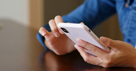 Woman use of cellphone in cafe