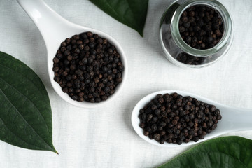 Fresh black cambodian pepper corn in bowl, cooking preparation