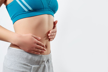 the concept of early pregnancy, proper nutrition, women's health. close-up photo of a slender...