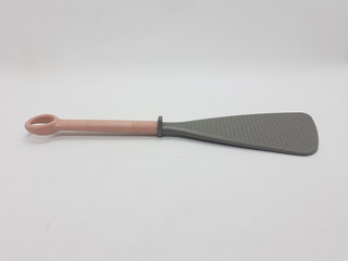 Beautiful Cooking Spoon from Plastic and Rubber for Kitchenware Utensils in White Isolated Background