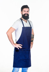 Barbershop staff. Beard grooming salon. Well groomed macho barber. Hipster style. Barbershop concept. Hairdresser barber salon for men. Man brutal bearded hipster with mustache wear apron uniform