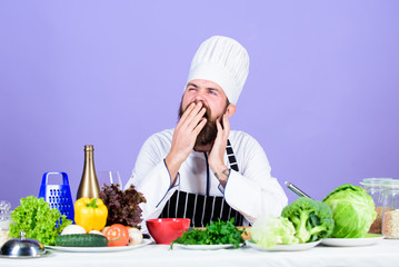 Healthy breakfast. Vitamin. man use kitchenware. Professional chef in cook uniform. Dieting with organic food. Fresh vegetables. tired bearded man cooking in kitchen. Healthy food and vegetarian