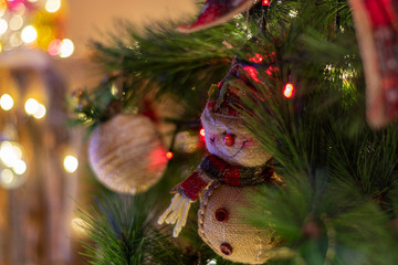 Decorated Christmas tree and creche on a blurred background, and you can see the lights and the warm colors which give it a true spirit and mood