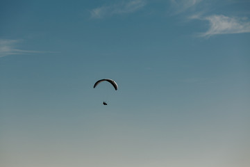 View of a paragliding in the sky. Paraglider flying over in The Nature Park Zumberak, Croatia 
