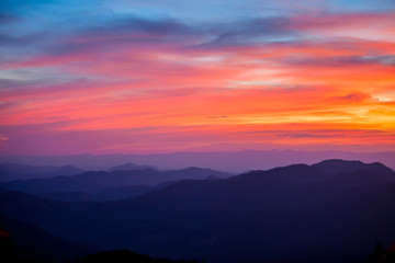 beautiful scenary in the north part of Thailand over the valley of mountain at sun rising giving a beautiful color.