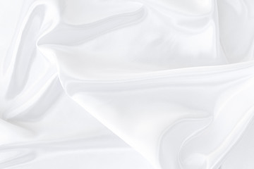 White gray satin texture that is white silver fabric silk background with beautiful soft blur...