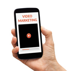 Hand holding smart phone with video marketing concept on screen