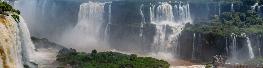 Panorama of Iguazu Falls in sunshine and mist