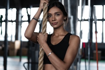 Fitness rope climb exercise in fitness gym workout
