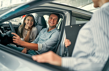 At a car dealership, buying a car