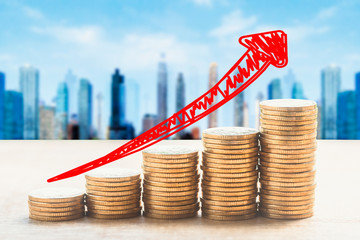 Stacked gold COINS and virtual city financial center background, financial stock market concept...