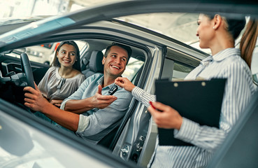 At a car dealership, buying a car