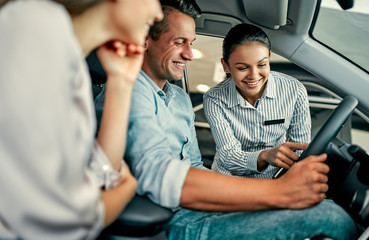 At a car dealership, buying a car