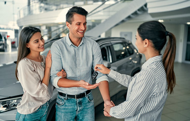 At a car dealership, buying a car