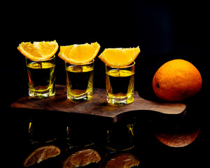 shot on a wooden board with orange slices