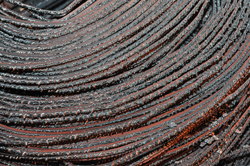 Steel rods or bars used to reinforce concrete.