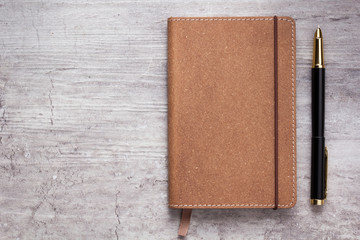 notepad or notebook paper at stone background