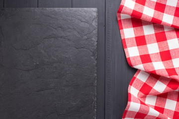 cloth napkin or  tablecloth checked at wooden plank board table