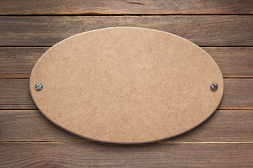 nameplate or wall sign at  wooden background
