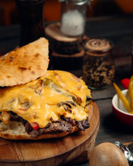 doner in a round tenir of meat, potatoes and cream cheese