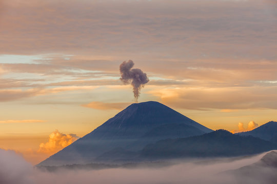 The beautiful mountaintop and crater of mount Bromo with sumeru in Indonesia that still active.
