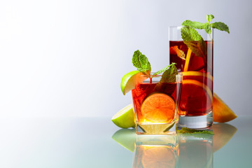 Ice tea with lemon, lime and mint.